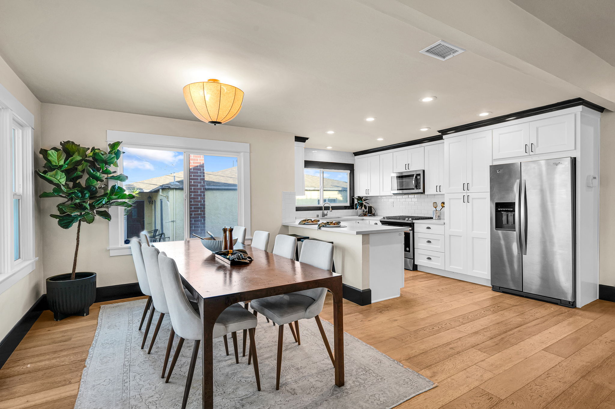 3235 Fenelon St. — Two fireplace living rooms, one open dining room.
