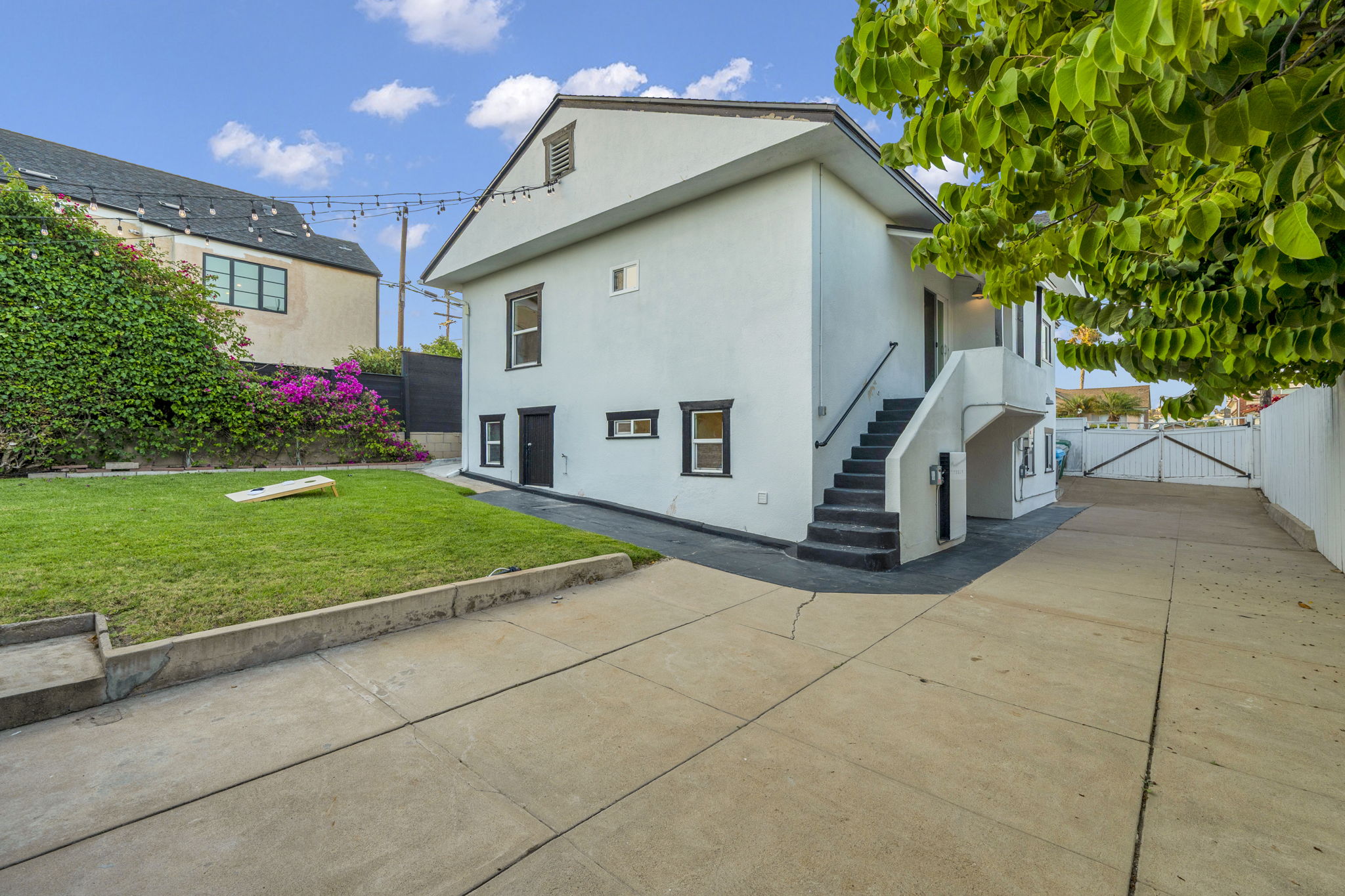 3235 Fenelon St. — A Craftsman behind a white picket fence.