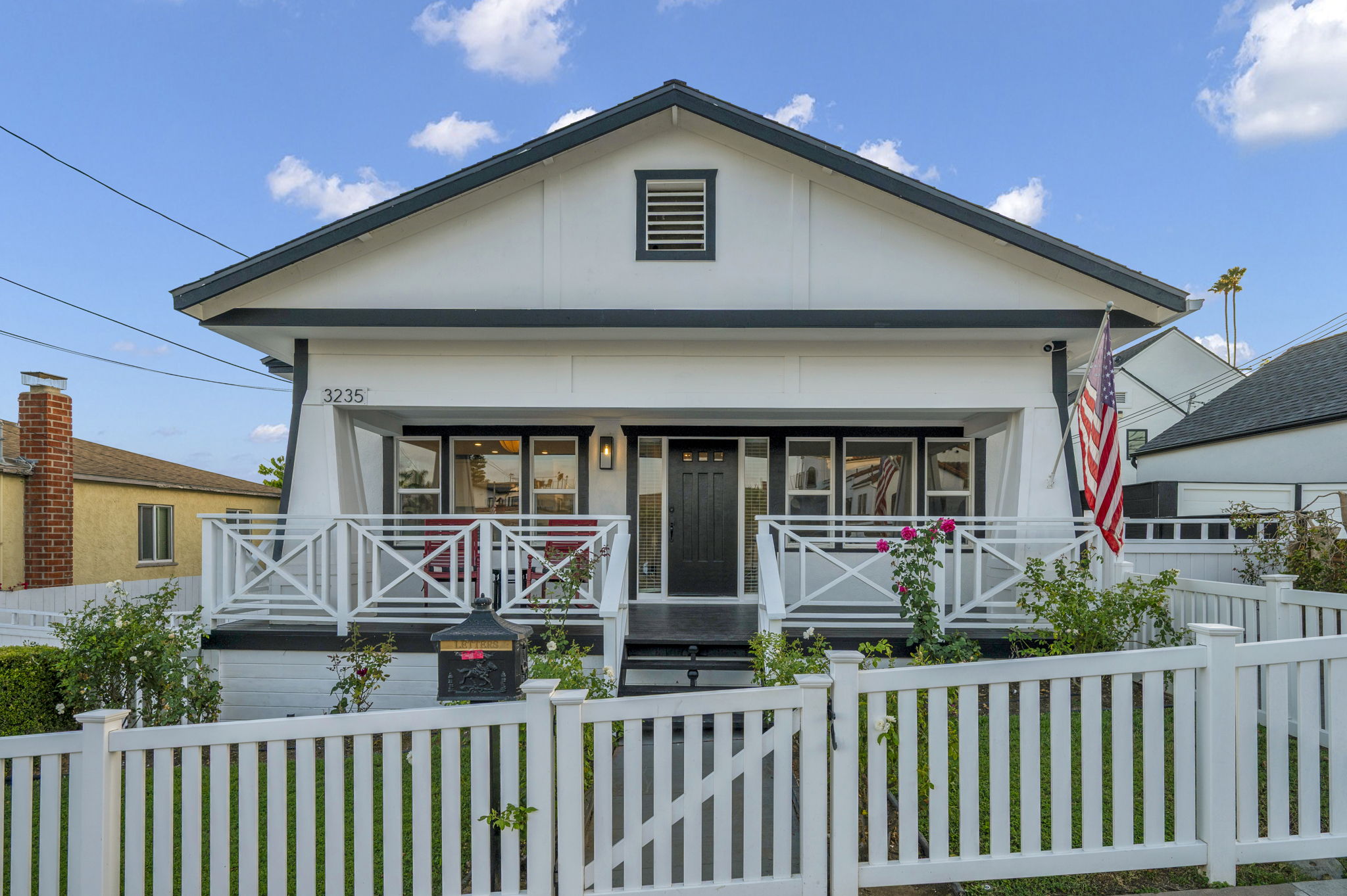 3235 Fenelon St. — A Craftsman behind a white picket fence.