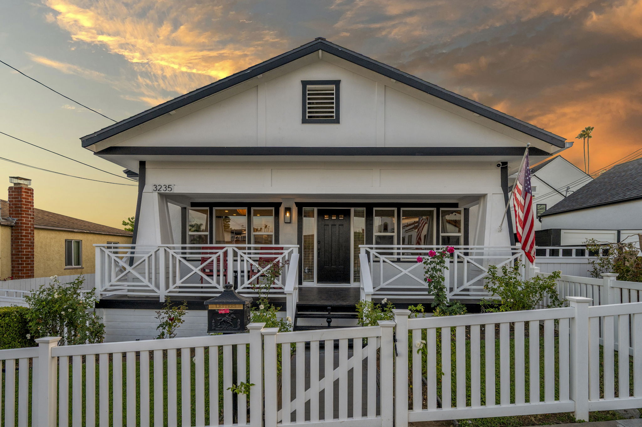 3235 Fenelon St. — A Craftsman behind a white picket fence.
