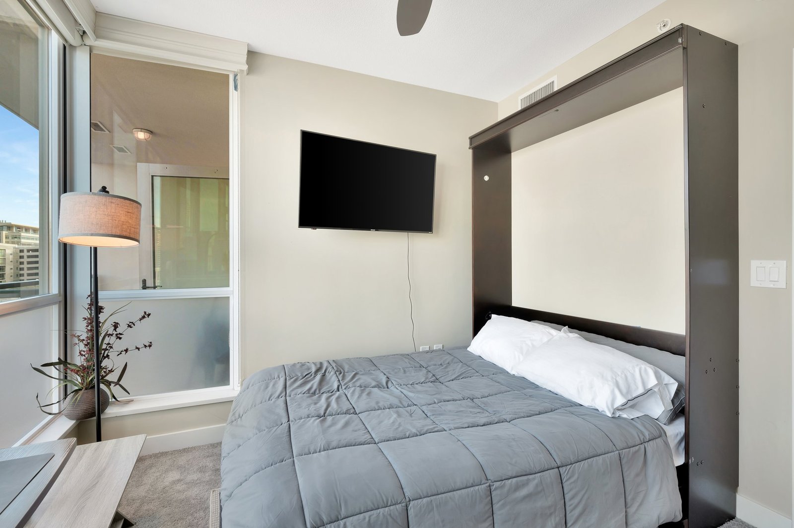 flex room with wall bed pulled down