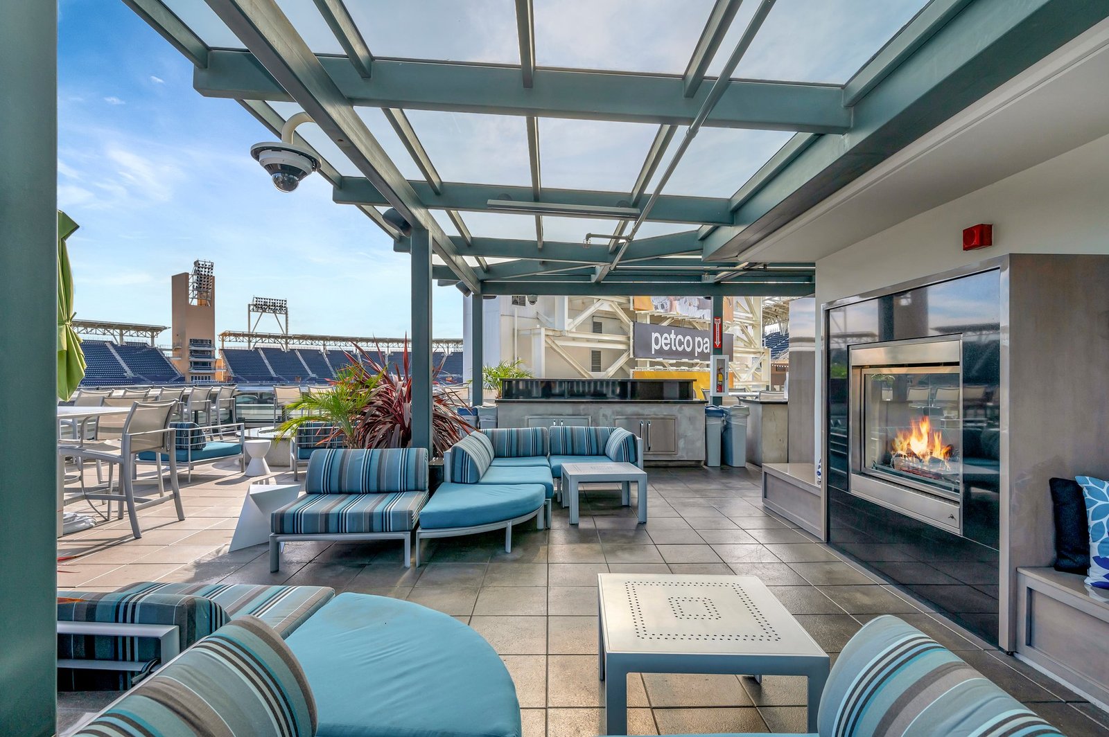 covered rooftop lounge with fireplace