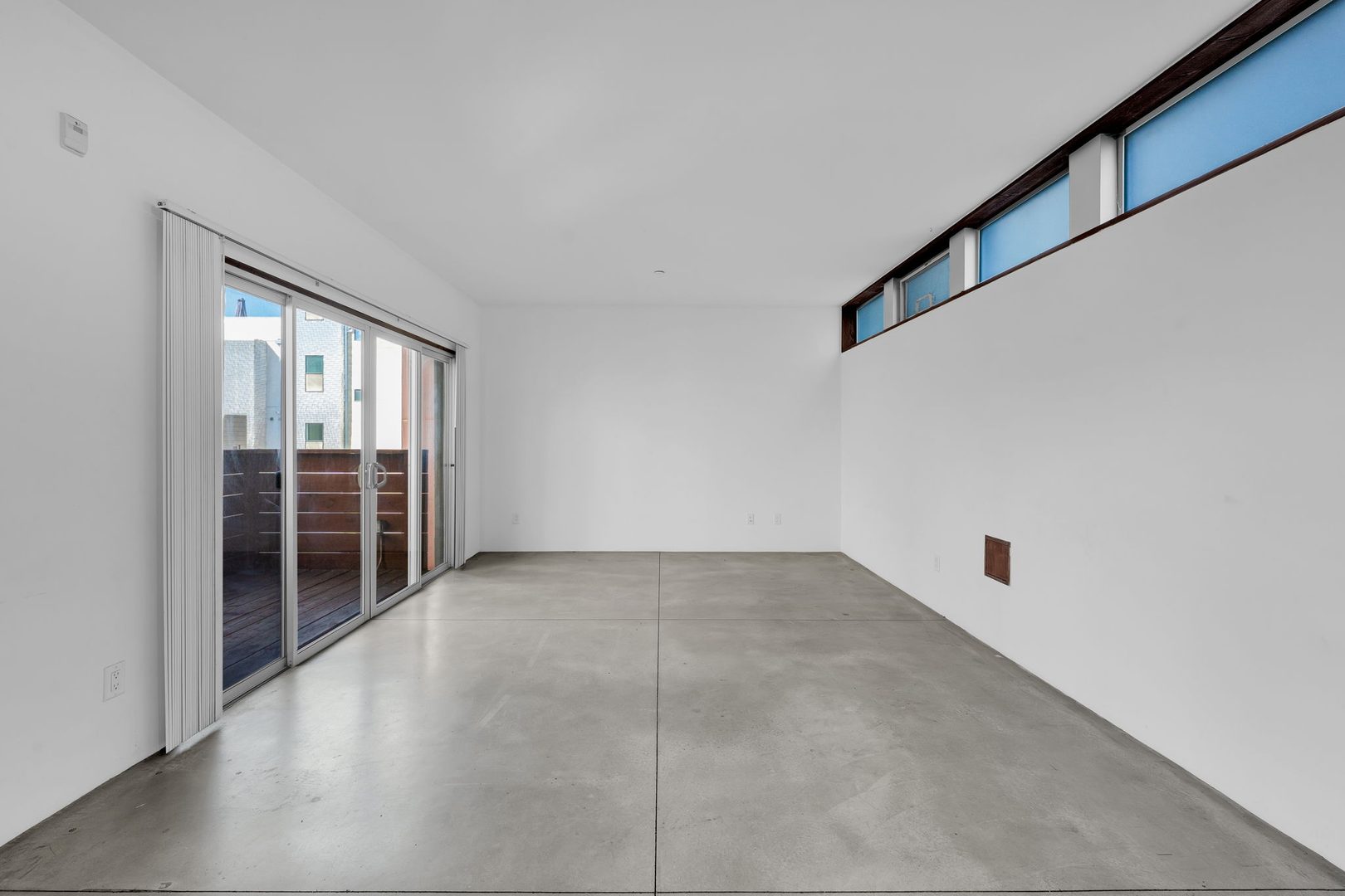 The Casita, Unit 303 &mdash; living room with sliders to the deck