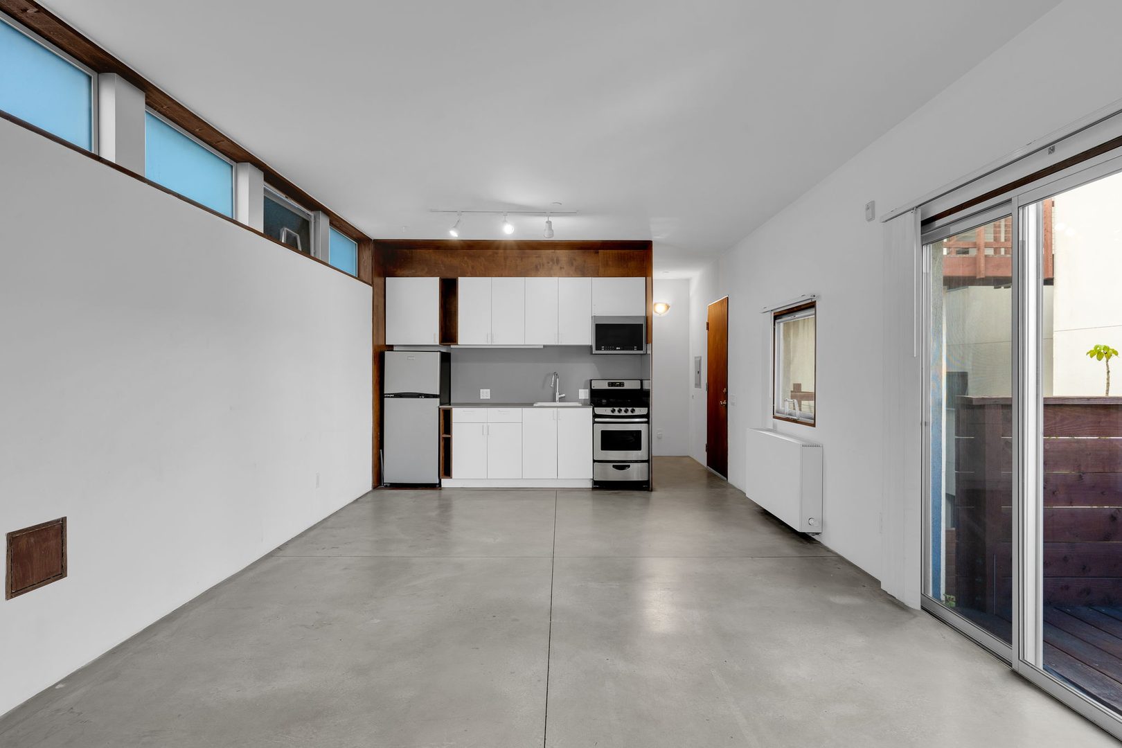 The Casita, Unit 303 &mdash; living area opening to the deck