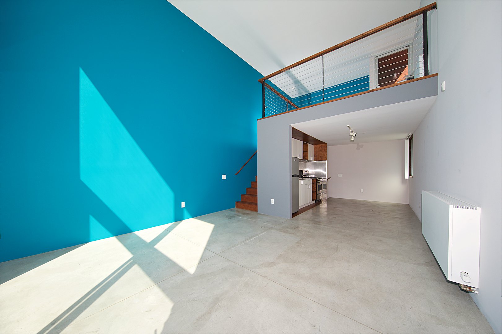 1941 Columbia St., #404 — living room with double-height ceiling